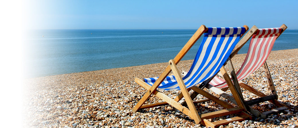 Tourism leisure deckchairs on beach