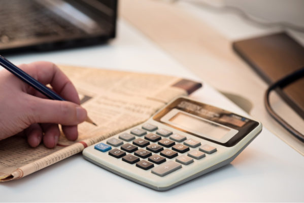 Image of a person using a calculator