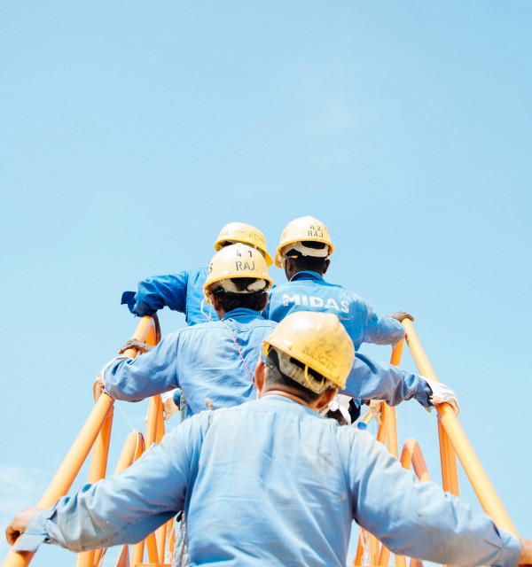 Construction industry workers climbing steps