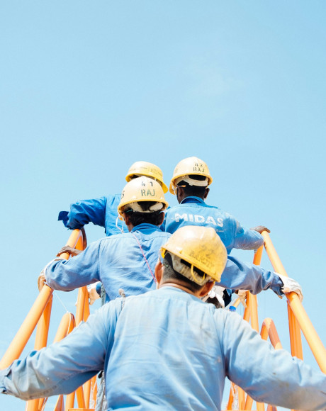 Construction industry workers climbing steps