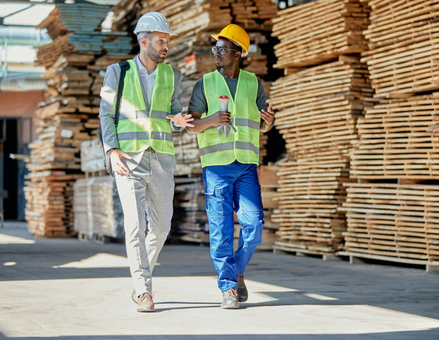 Construction industry workers discussing financial plans