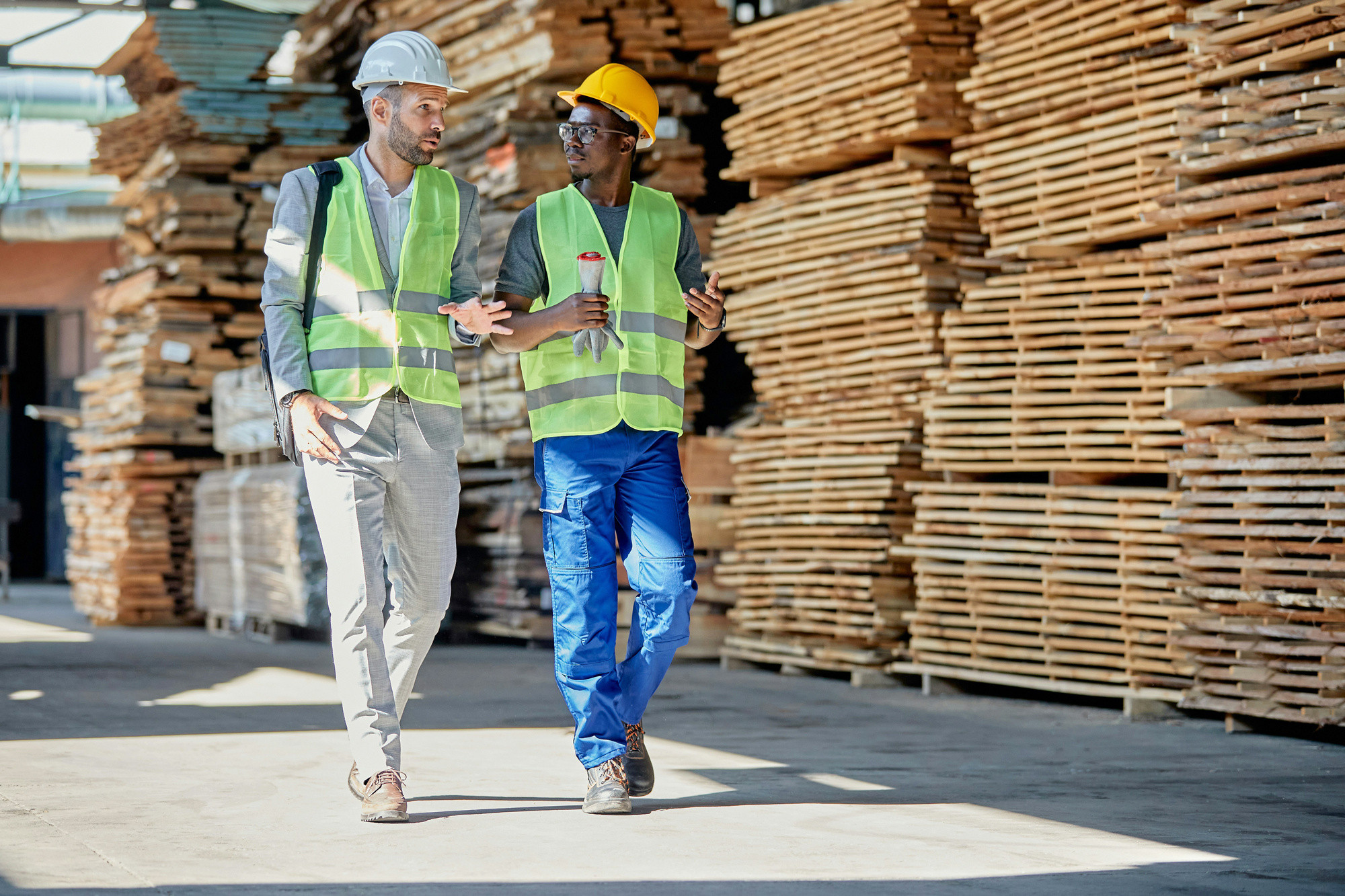 Construction industry workers discussing financial plans