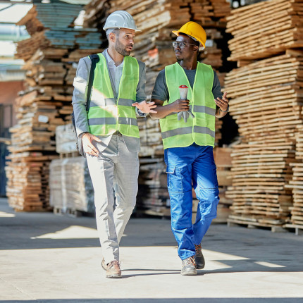 Construction industry workers discussing financial plans